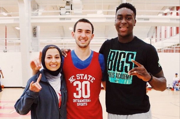 NC State forward Abdul-Malik Abu (right) with Deah Shaddy Barakat and Yusor Mohammad Abu-Salha.